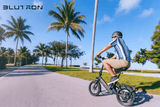 Compact versatile Blutron foldable electric bike - Space-saving design ideal for urban commutes and casual rides on scenic coastal paths