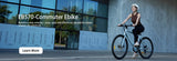 Helmeted woman on EB570 commuter ebike near modern glass building—ideal for smooth urban commutes.