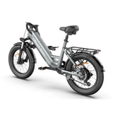 Blutron silver-gray folding ebike: Equipped with a sturdy folding ebike rack, wide tires, front/rear disc brakes, and the "BLUTRON" logåo, showcased against a clean white background.